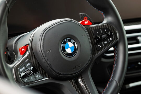 Lucerne, Switzerland, May 30, 2026. Close-up view of the BMW roundel logo on a leather M sport steering wheel