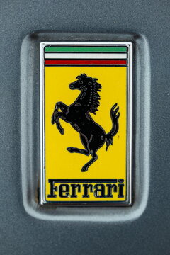 Lucerne, Switzerland, May 30, 2026. Rectangular enamel Ferrari prancing horse logo badge on silver car