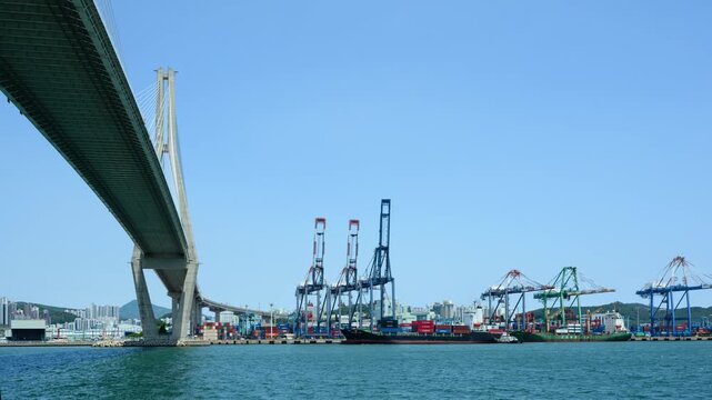 Cargo Ship Docking at Busan Port with Tugboat Assistance and Maritime Operations Timelapse
