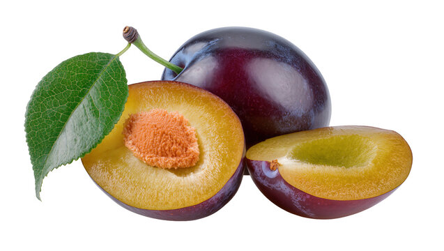 Whole and halved dark purple plums with green leaf