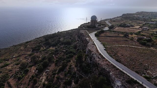 The Dingli Cliffs form a massive natural wall along Malta's isolated western coast, representing the highest point of the Maltese islands at over 250 meters above sea level.