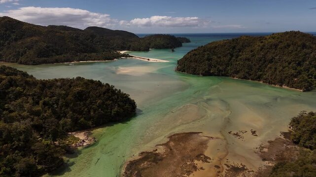Aerial view of the unique tidal estuary and sandspit at Torrent Bay along the Abel Tasman Coast Track on the South Island of New Zealand.