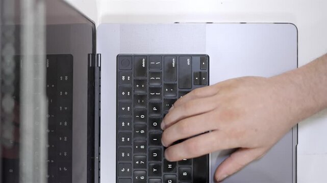Top down shot hand typing on computer keyboard workspace and coffee