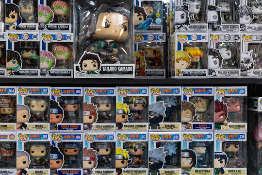 Funko Pop vinyl figures of Tanjiro Kamado and anime characters on shop display shelf