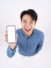 Naklejka premium Asian man holding smartphone viewed from above