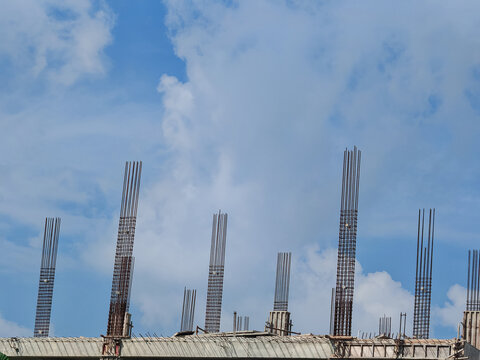Reinforced Concrete Columns Under Construction Against Blue Sky