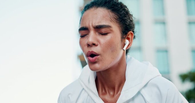 Tired, woman and fitness with sweat in city for workout break, rest or outdoor breathing exercise. Exhausted, female person or runner catching breathe for intense training, cooldown or recovery