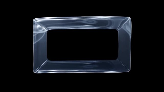 Slow motion rotation of transparent inflatable rectangular plastic frame rotating and drifting on black studio background