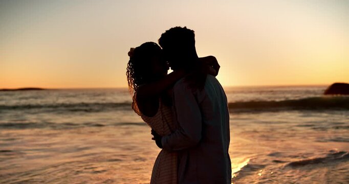 Sunset, beach and black couple with forehead touch for love, bonding and intimate moment. Care, hug and African man with woman for connection, support or trust by ocean for seaside holiday together.