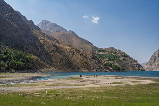 Scenic mountain landscape view of turquoise blue Marguzor lake in remote Seven Lakes aka Haft Kul, Shing river valley, Sughd, Tajikistan