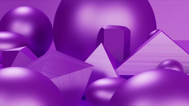 Panning shot of purple geometric shapes moving across studio tabletop set with spheres pyramids cubes in monochrome abstract composition