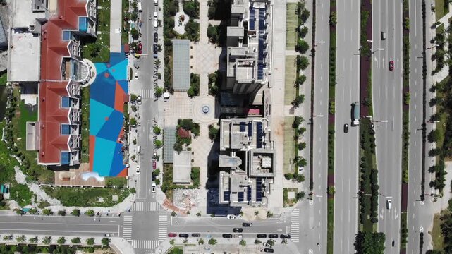 Aerial Top View of Modern Residential Buildings and Colorful Playground by Wide Boulevard