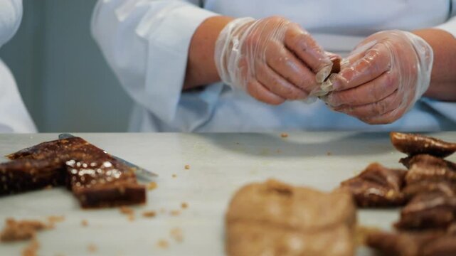 close up of a man holding a tray with chocolate cookies
