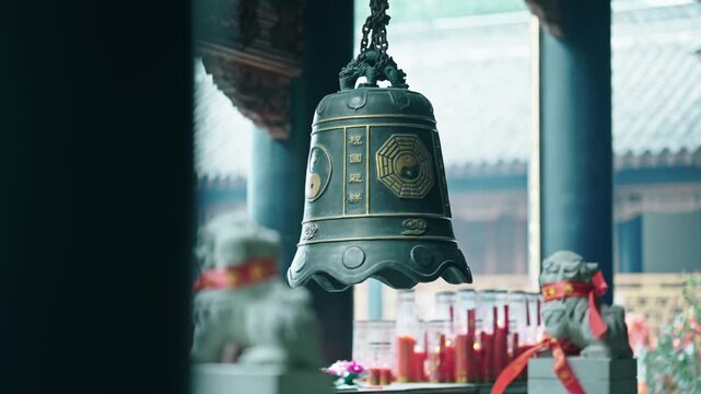 Hanging Bronze Temple Bell with Yin Yang Symbols in Traditional Shrine