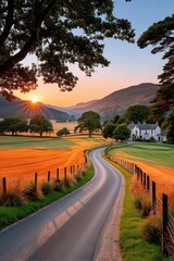 Fototapeta premium Sunset over winding country road leading to a white farmhouse in golden fields