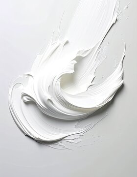 A dynamic splash of thick white paint or cream swirls across a light gray background.