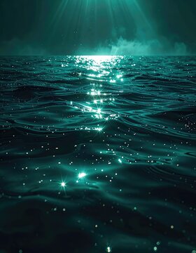 Sunlight glitters on the dark ocean surface with rays shining down from above.