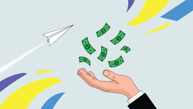 Close up of a human hand catching falling green dollar bills with a paper airplane flying in the distance against a grey background.