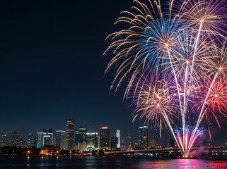 Fototapeta premium Vibrant Fireworks Exploding Over Modern City Skyline at Night with Copy Space on Left