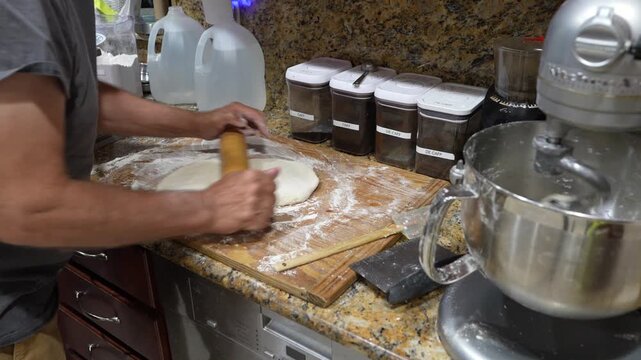 Dough Being Rolled Out in a Home Kitchen