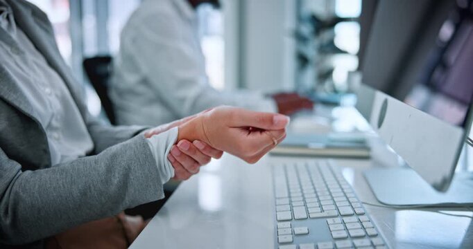 Hands, keyboard and employee with wrist pain in office, coworking and overworked with muscle tension. Business, pressure and person with injury after work accident, strain and typing on computer
