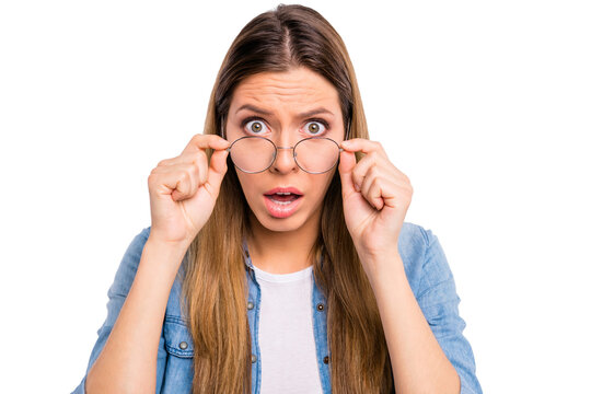 Close-up photo of scared terrified frightened pessimistic lady adjusting specs agent trader worker looking at you isolated grey background