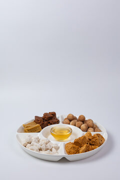 Traditional Asian sweets and kurt cheese assortment on white background