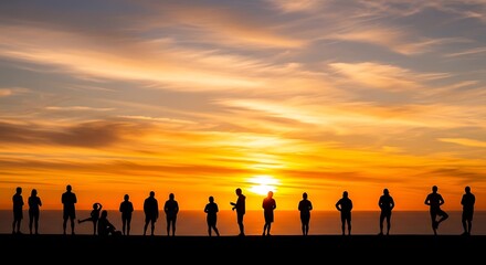 Fototapeta premium Group of silhouetted people standing on a beach during a vibrant sunset.