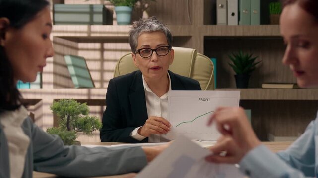 Three diverse business women specialists emotional discussing document diagram graph problem planning financial marketing strategy multiracial businesswomen females bookkeeping office company budget