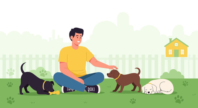 Man playing with dogs in the yard, happy pet owner with puppies, outdoor leisure