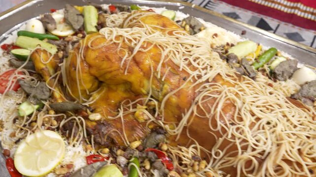 Close-Up View of a Whole Roasted Lamb Mandi Served on a Large Tray of Traditional Saudi Rice