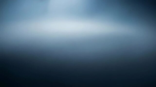 Blurred dark misty texture for horror background. Mysterious blue vapor cloud for cinematic effect. Frightening smoke environment with copy space for thriller scene.