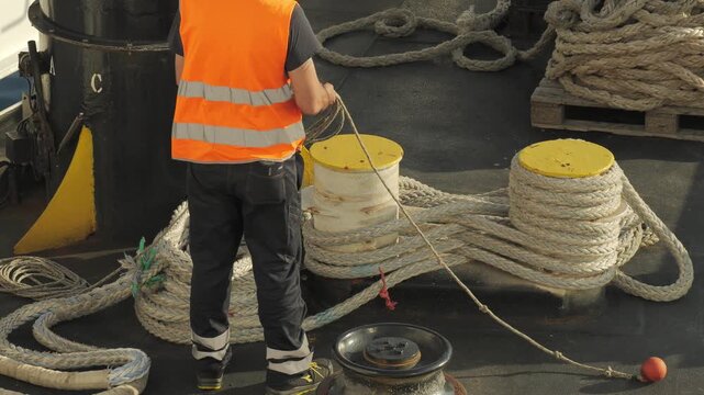 Ferry workers on deck during port operations, Piombino, Italy. June 2, 2026