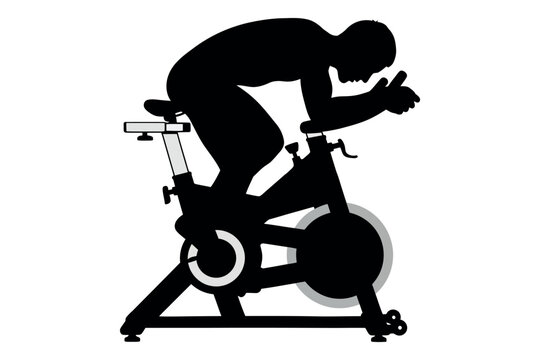 Intense indoor cycling silhouette a determined athlete pushing limits on a stationary bike