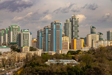 Obraz premium Pyongyang city view from Arch of Triumph. Cherry blossoms. Ryomyong St, Moranbong St, Sungri St, Kaeson subway, Kaeson Cinema, unfinished Ryugyong Hotel.