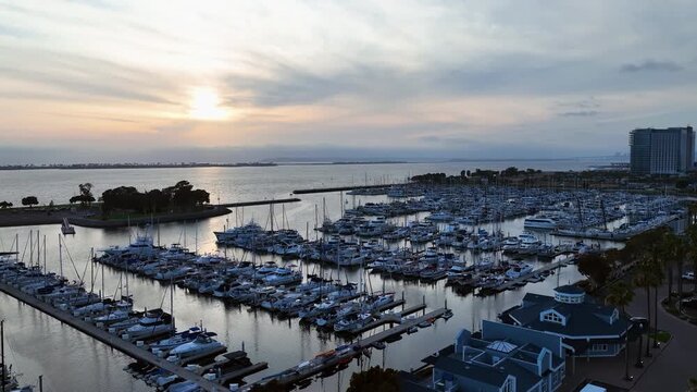 Aerial view of Chula Vista Harbor marina packed with boats, sunset in California