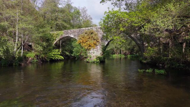 Historic Bridge Of Ponte Medieval de San Alberte In Guitiriz, Galicia, Spain. Low Wide Shot