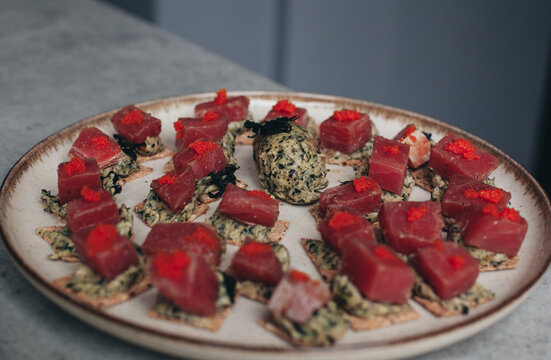 canap&eacute;s on a plate with tuna