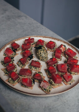 canap&eacute;s on a plate with tuna
