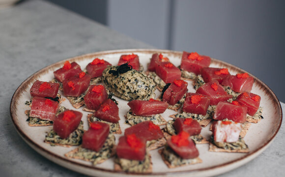 canap&eacute;s on a plate with tuna