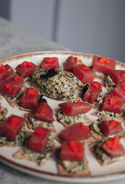 canap&eacute;s on a plate with tuna