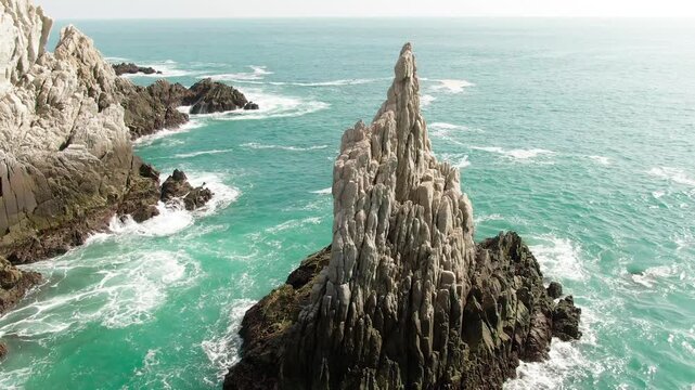 Close up aerial view of Dedo de Dios volcanic rock formation in Pacific Ocean waters, Mexico