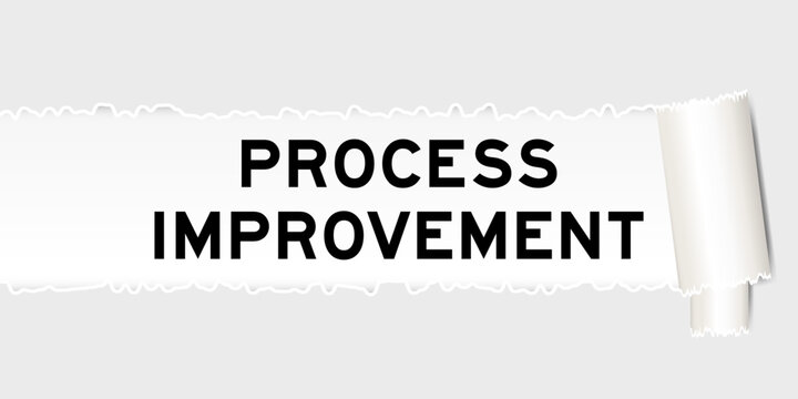 Ripped gray paper background that have word process improvement under torn part