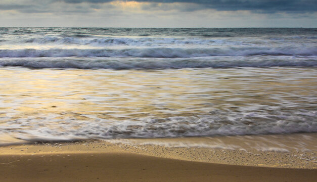 Waves coming ashore early in the morning