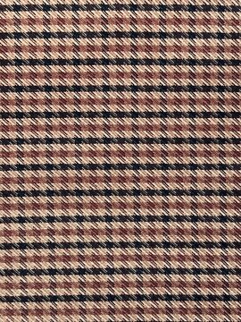 Brown houndstooth pattern fabric texture close up background