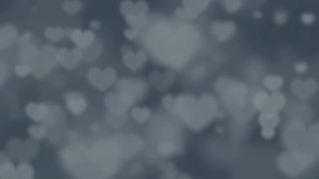Blurred heart shapes dance in soft focus romantic background