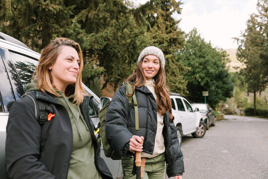 Hikers prepare for a winter mountain hike at trailhead