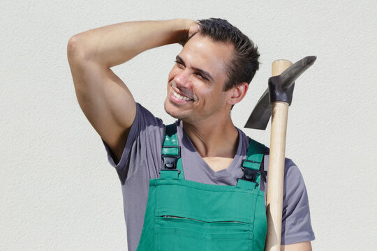 sexy gardener holding a tool