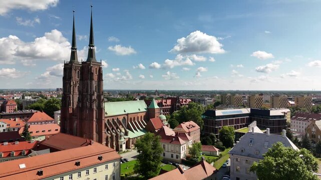 Aerial footage of the city center of Wroclaw, Poland. Collegiate Church of the Holy Cross and St. Bartholomew