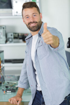 handsome worker showing a thumb up